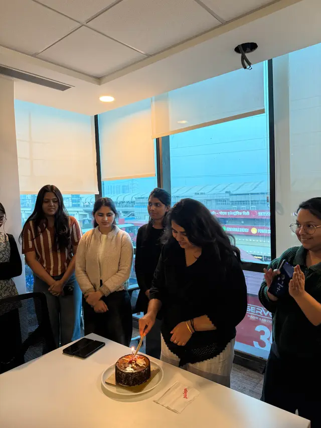 Cutting a cake in the office