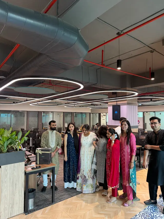The team together on the office floor