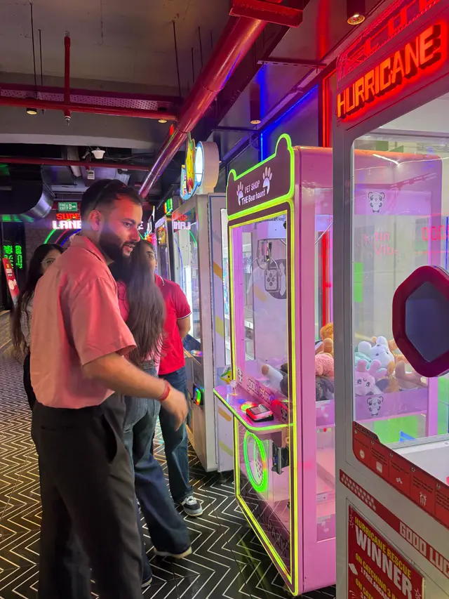 Team members at the claw machines