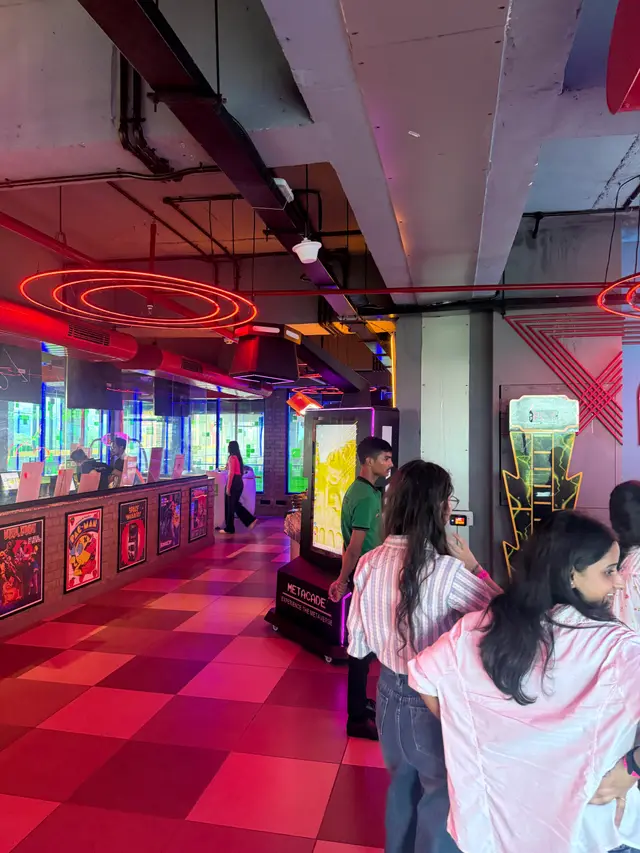 Team members exploring the arcade