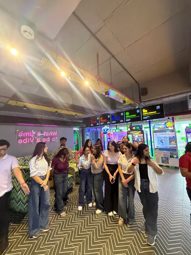 The Uhire team lined up at the arcade