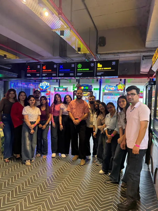 The Uhire team together at the arcade