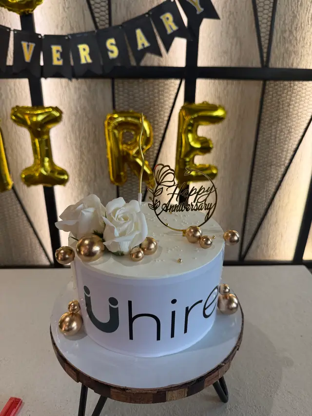 The Uhire anniversary cake with the Uhire logo