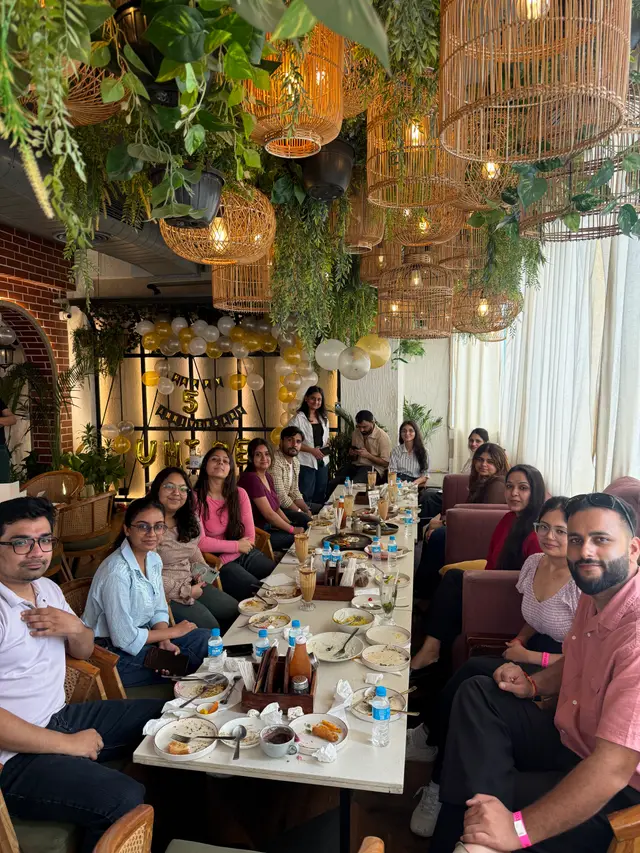 The whole team at the anniversary lunch table