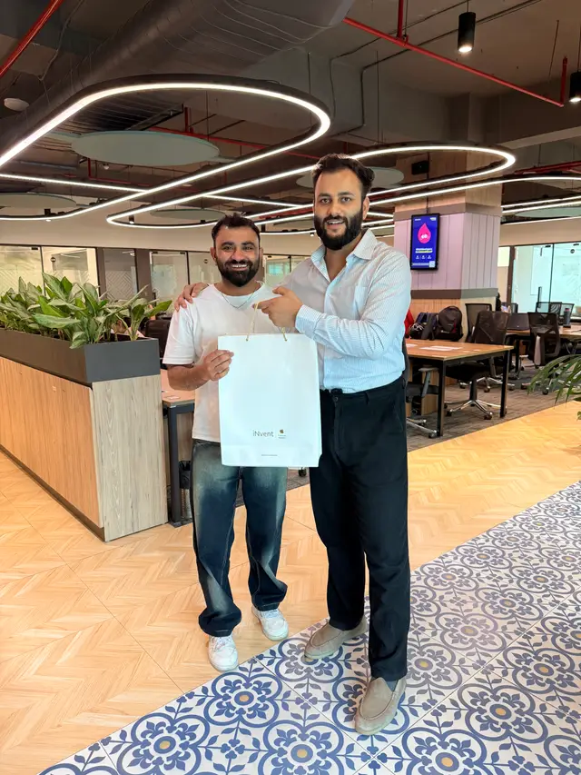 The founder gifting a MacBook to a manager